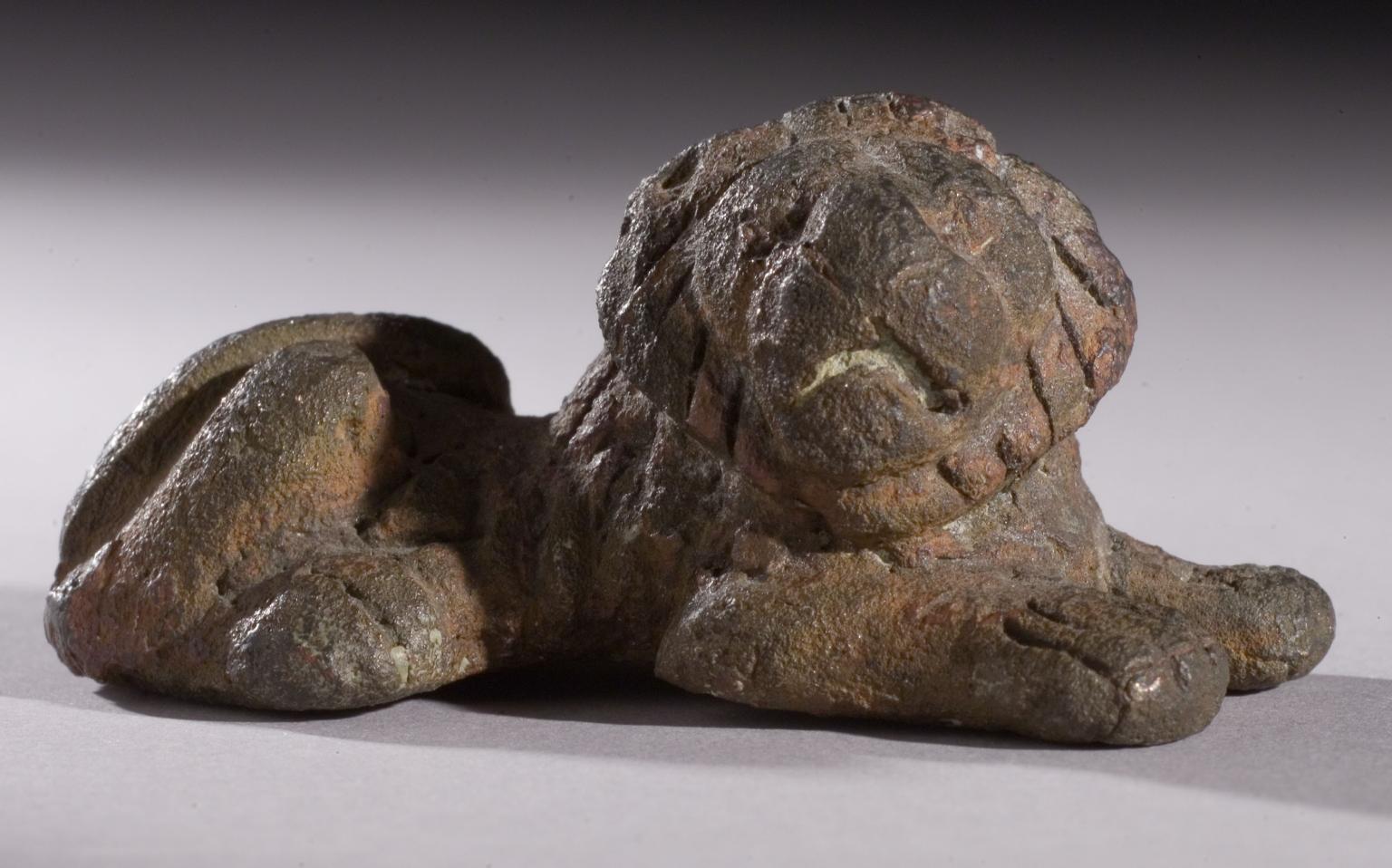 Bronze weight in shape of crouching lion.