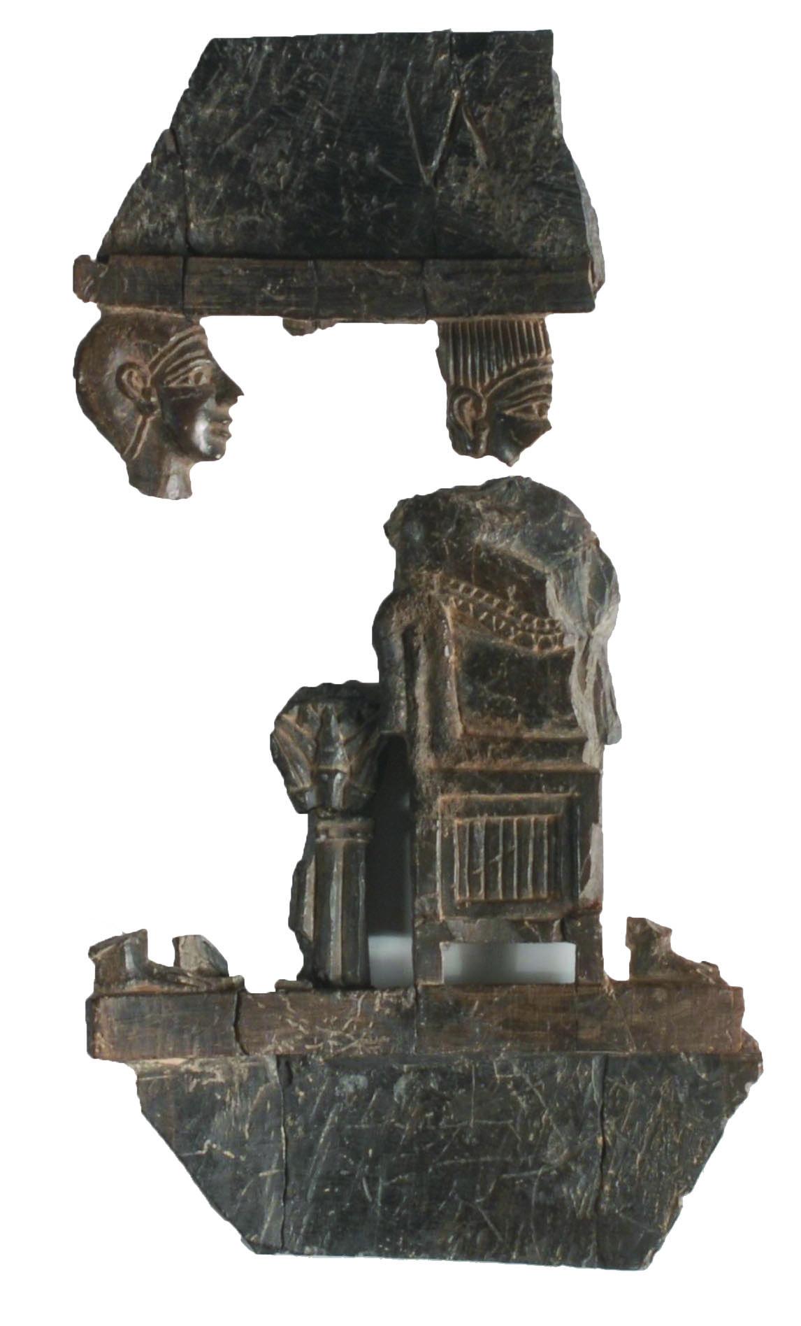 Ivory carving in two disconnected fragments, one with two heads and the other one with a body on a throne.