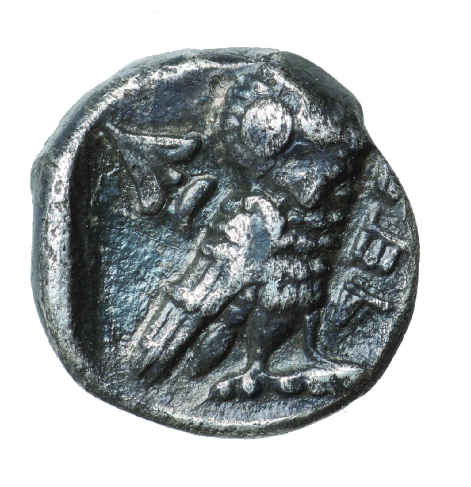 Coin with image of an owl and flora with a Hebrew inscription.