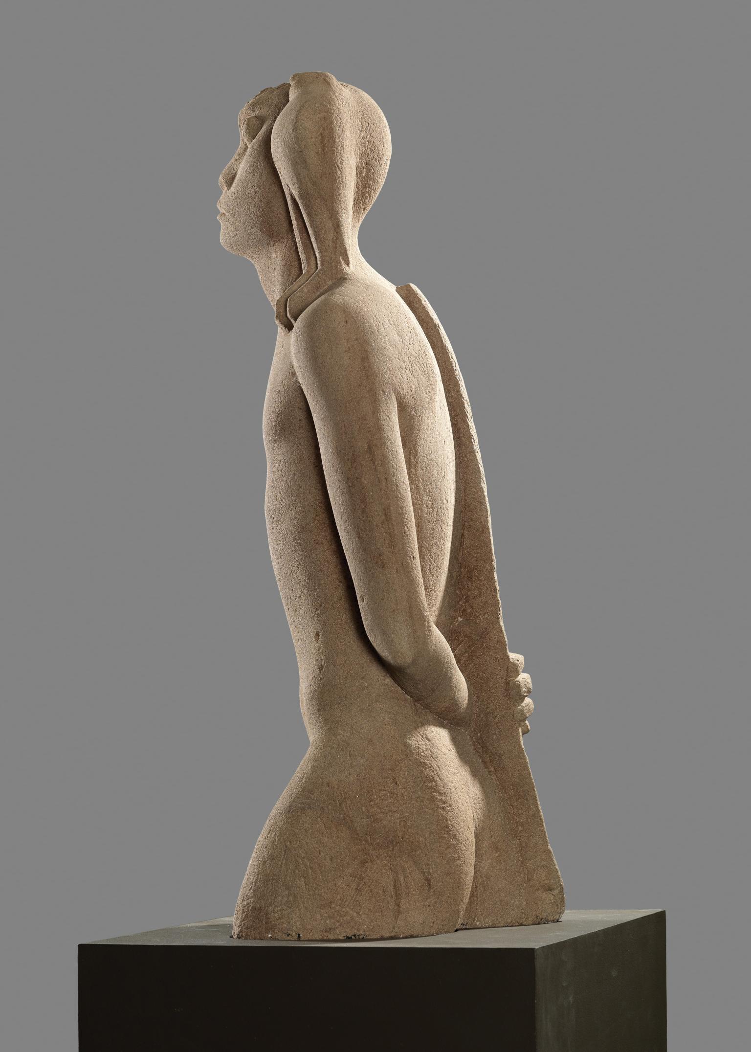 Sandstone sculpture of the upper torso of a naked man with animal features and a bow along his backbone. 