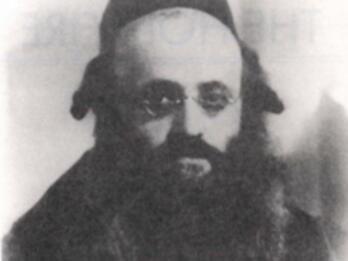 Black and white image of an Orthodox Jewish man wearing spectacles.