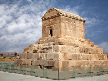 Tomb of Cyrus Photograph of stone tomb on top of tiered platform.