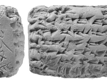 Clay tablet with cuneiform inscription.