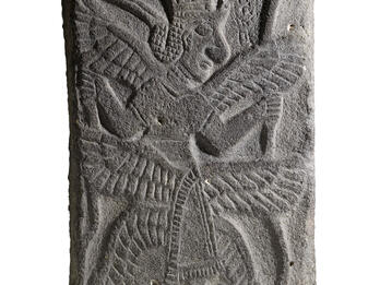 Relief of figure with six wings and headdress.