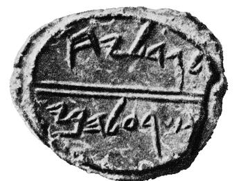 Round clay piece inscribed with Hebrew.