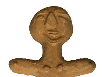 Sculpture of human-like figure.