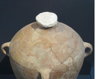 Storage Jar with Lamalekh Stamp Large clay storage jar with stopper in neck and handle stamped with Hebrew letters.