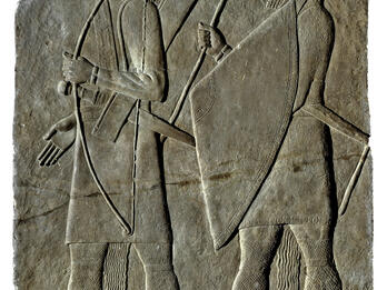 Relief with one archer holding bow and soldier with large triangular shield.