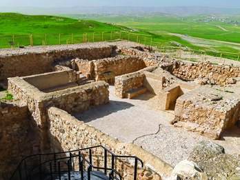 Photograph of ruins of stone buildings.