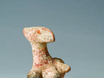 Judahite Pillar Figurine with Hand-made Head Terra-cotta figurine with enlarged head and breasts.