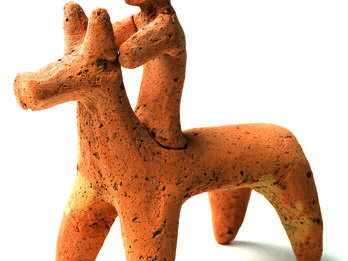 Terra-cotta figurine of horse and rider.