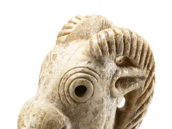 Ivory Stopper Shaped Like an Ibex Head Ivory stopper in shape of ibex head with open mouth.