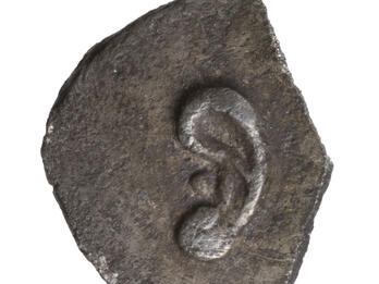 Coin with image of an ear with pronounced lobe.