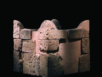 Reconstructed stone altar with horns at four upper corners.