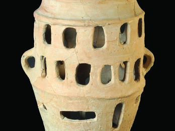 Ceramic offering stand with four rows of windows and small protruding feet with five toes on the bottom row of windows.