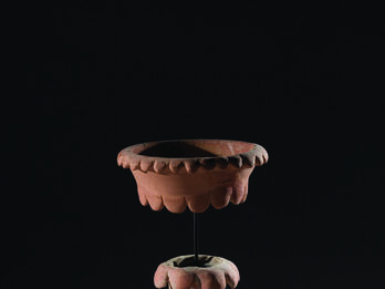 Ceramic Chalice from Arad Ceramic chalice with tall, hollow stand and bowl in a separate piece on top and secured to bottom of chalice with a rod.