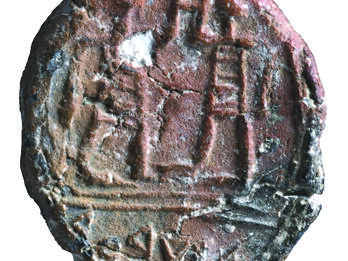 A stone seal with line drawing of two men facing each other raising one hand toward the other and Hebrew inscription.