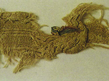 Linen with Colored Wool Decoration Woven linen fabric with two stripes in fragmentary state.