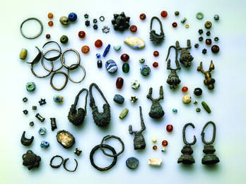 Collection of earrings and beads. 