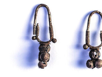Silver Earrings Pair of earrings with rounded attachment.