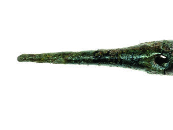 Bronze pin decorated with ribbing.