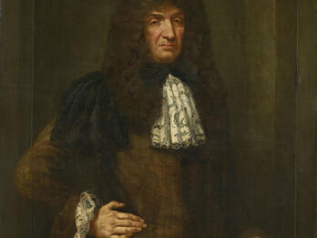 Portrait of Don Antonio Lopes Suasso Portrait painting depicting man with long wavy hair standing facing viewer with right hand on hip, dressed in coat with lace cuffs and lace collar.