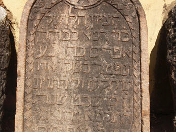 Tombstone with Hebrew text.