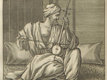 Jewish Man in Cairo Print depicting man in turban and draped robe sitting amid pillows and playing instrument with bow.