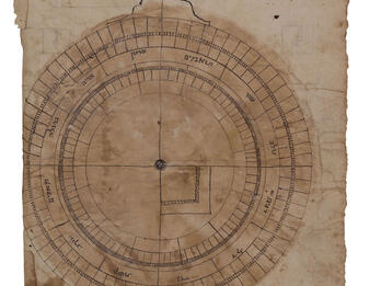 Paper Astrolabe Drawing of circle with many lines forming squares and rectangles within it.
