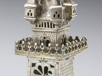 Spice Container Container in the shape of a four-story tower with doors and windows cut out.