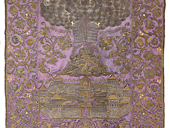 Torah Ark Curtain Cloth with embroidered image of tablets in clouds above mountain and city.