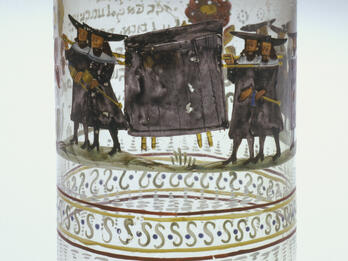 Beaker of the Polin Burial Society Glass beaker with painting of figures carrying enclosed stretcher.