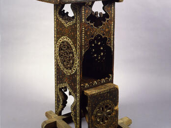 Reader’s Desk Wooden lectern with geometric designs.