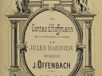Tales of Hoffmann Printed page of French text surrounded by columns and three classical figures on top, one seated in center holding a scroll, another holding a harp, and a third holding a mask.