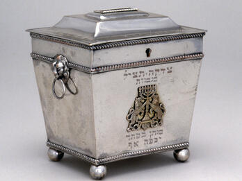 Alms Container Silver cast and engraved container featuring lions holding menorah.