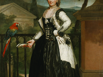Portrait of the Marquesa de Llano Full body portrait painting of woman wearing gown and hat standing in front of a railing next to parrot.