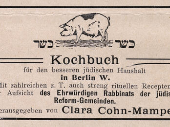 Printed page with Yiddish text and small drawing of pig.