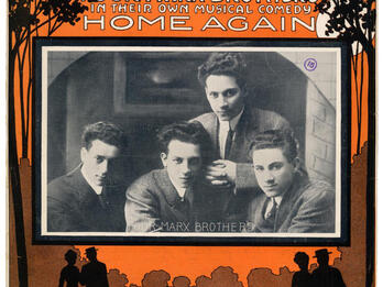 Page with English text on top and bottom with center photograph of four men, and silhouettes of two couples on the bottom.