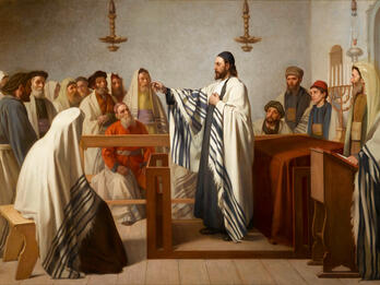 Painting of many figures in prayer shawls and beards sitting and standing in room with benches and podiums.