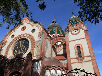Photograph of building exterior with rounded roofs