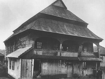 Jabłonów Wooden Synagogue Photograph of wooden building with tiered triangular roof.