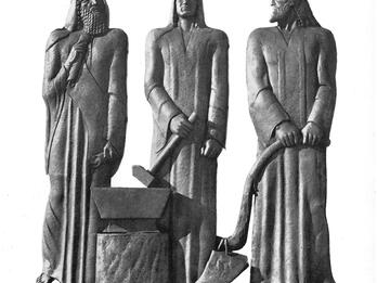 Copper relief sculpture depicting three hooded men. The one on the left holds a scroll and has a long beard, the middle holds a hammer, and the right holds a hand plow and has a short beard. 