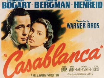 Movie poster featuring image of man and woman cheek-to-cheek, surrounded by English movie title and actors' names.