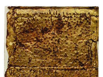 Sculpture of nails and iron on a rectangular wood panel.