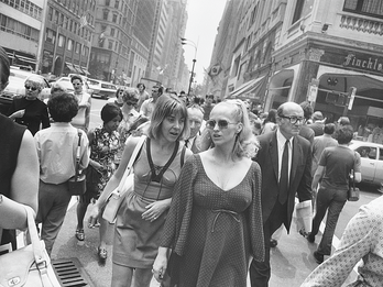 New York, ca. 1970 Photograph of two women walking down busy city street toward photographer.