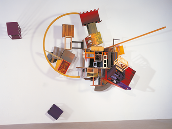 Jamma’in II Industrial paint on wood sculpture mounted on wall featuring half moon shaped piece of wood and boxes.