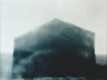 Chromogenic print depicting blurry building.