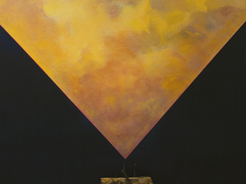 Art installation of inverted triangle with object underneath.
