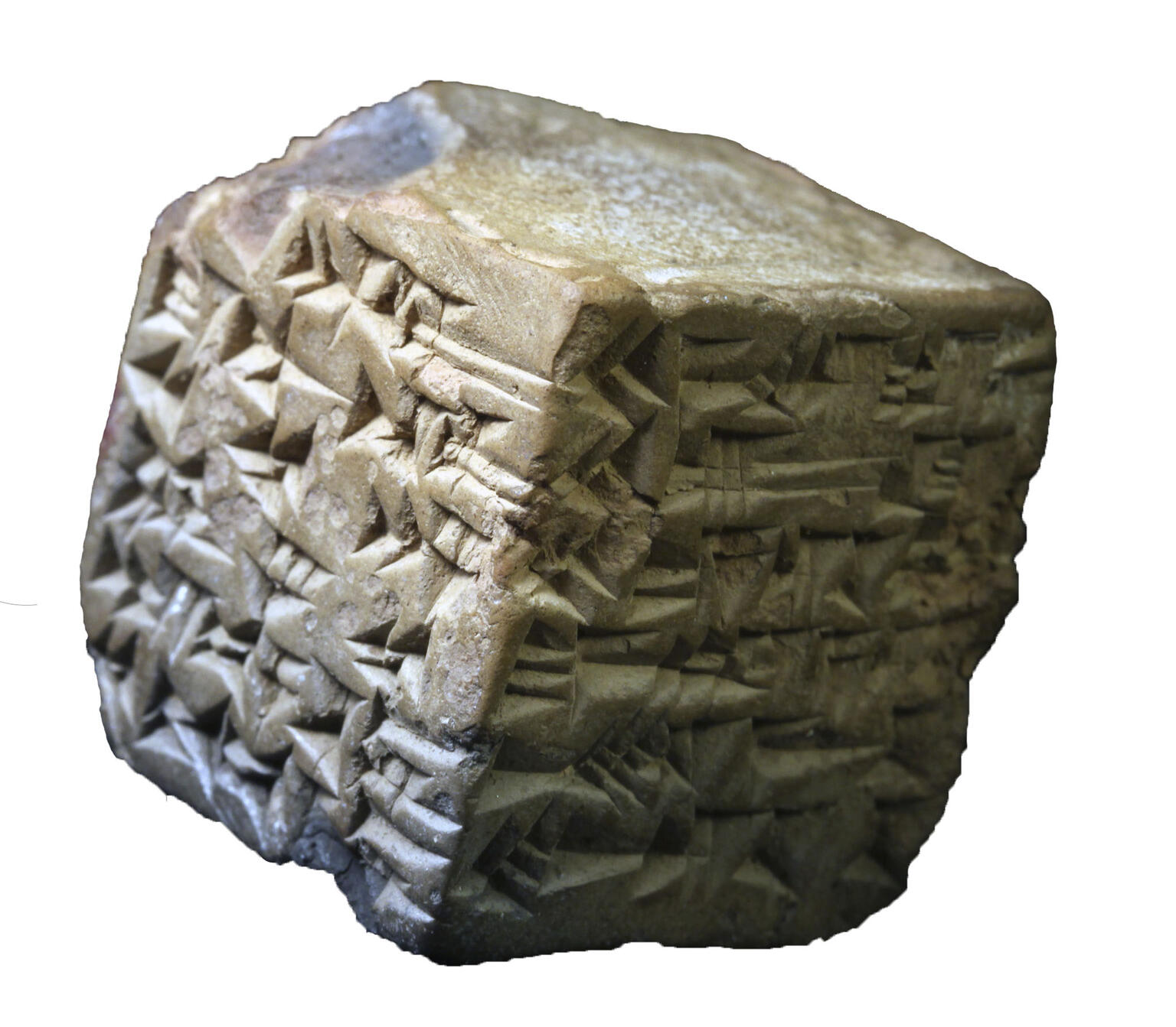 Stone cube inscribed with cuneiform. 