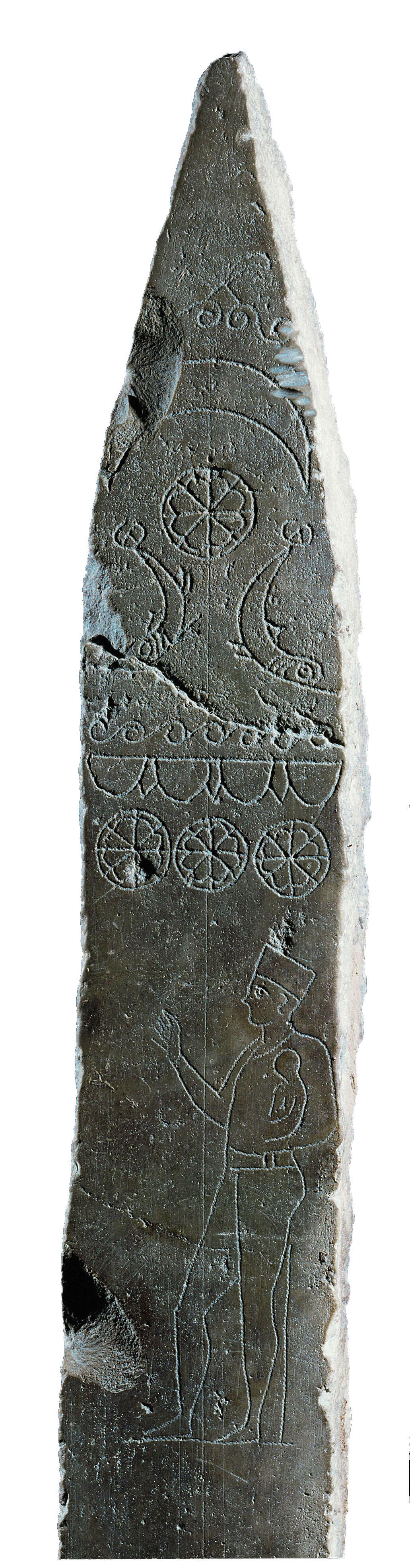 Stela with images of celestial shapes on top and man holding small child below. Stela with images of celestial shapes on top and man holding small child below.